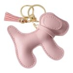 llavero de perrito rosado sintético